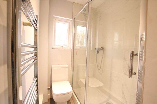 A Bright And Modern Bathroom Featuring A Sleek Sho...