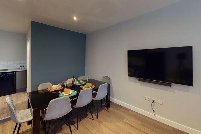 A Modern And Inviting Living Room Perfect For Soci...