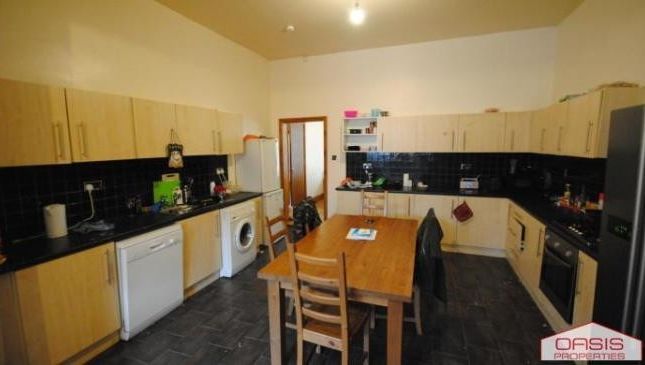 A Modern And Well-Maintained Kitchen With Ample Co...