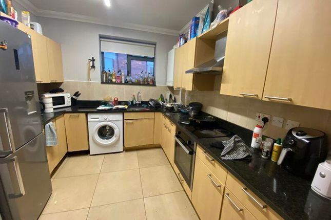 A Spacious Kitchen Equipped With Modern Appliances...