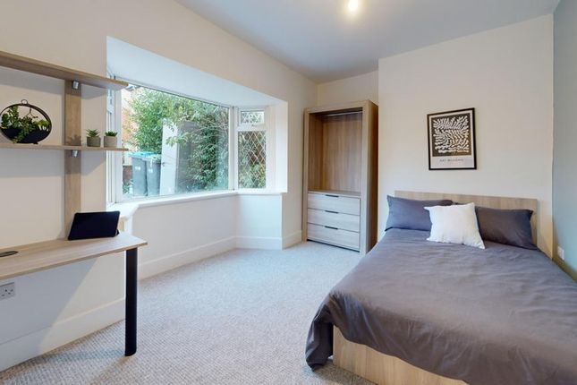 A Bright And Tidy Double Bedroom Featuring A Comfo...