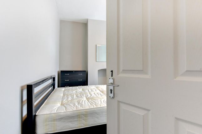 A Bright And Tidy Bedroom With A Comfortable Doubl...