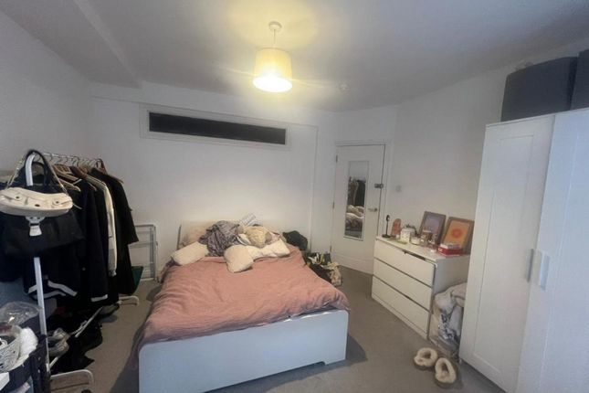 A Cozy Double Bedroom Featuring Ample Storage And ...