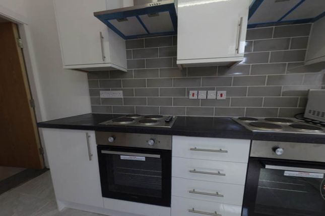 A Modern, Well-Maintained Kitchen Featuring Sleek ...