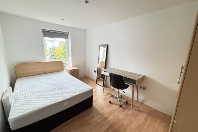 Bright And Spacious Master Bedroom Featuring A Dou...