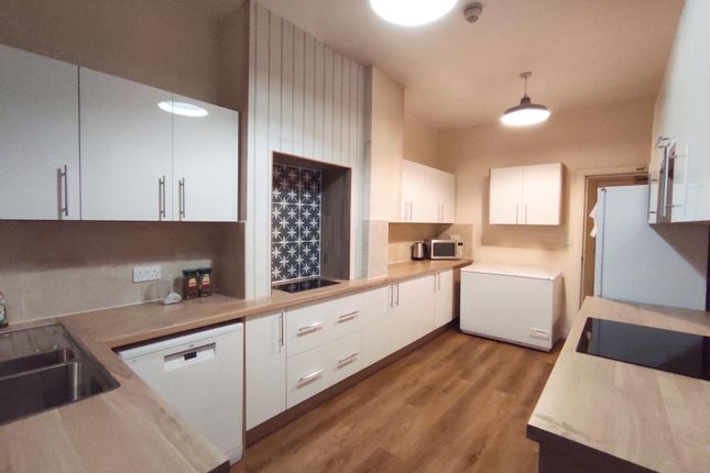 Bright Modern Kitchen With Light Wood Countertops,...