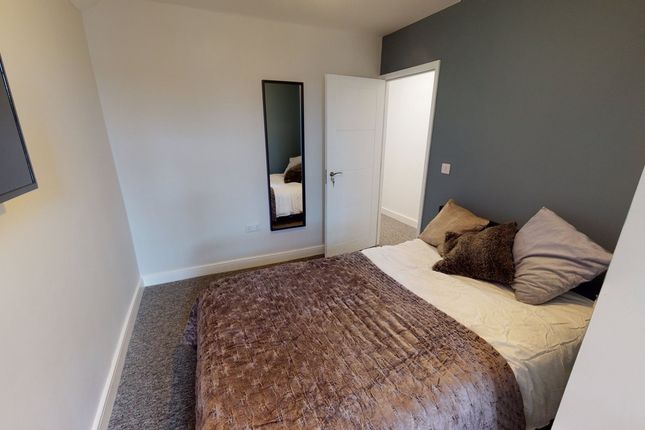 A Cozy And Inviting Double Bedroom With A Stylish ...