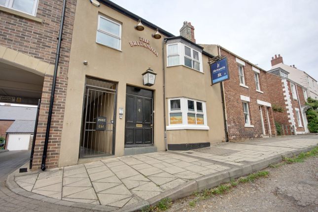 The Charming Exterior Of A Well-Maintained Propert...