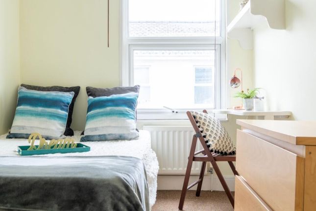 This Inviting Double Bedroom Features A Cozy Atmos...