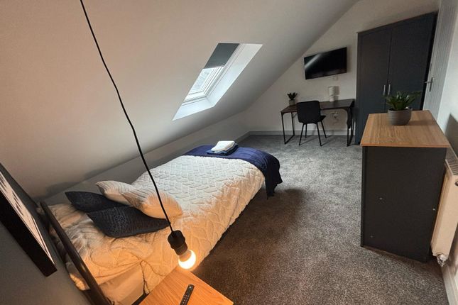 Charming Double Bedroom Featuring A Cozy Layout Wi...