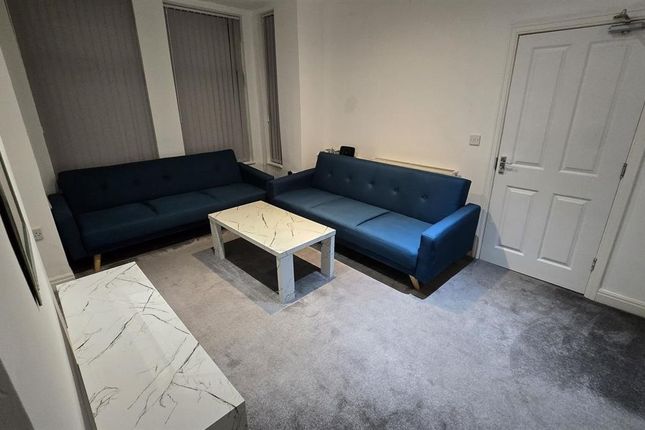 A Contemporary And Welcoming Living Room Featuring...