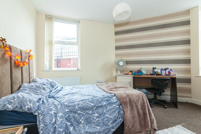 A Cozy Double Bedroom Featuring A Comfortable Bed ...