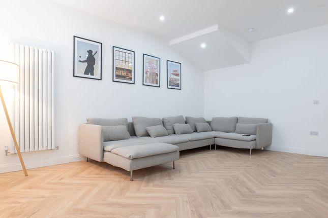 Bright, Modern Living Room With A Large L-Shaped G...