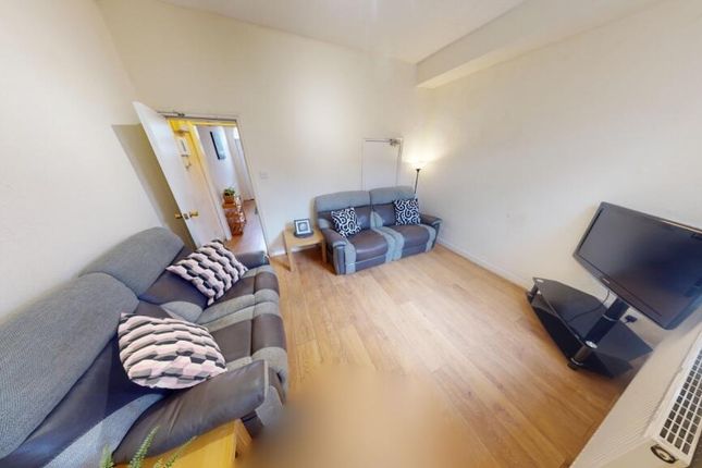 A Bright And Welcoming Living Room Featuring Moder...