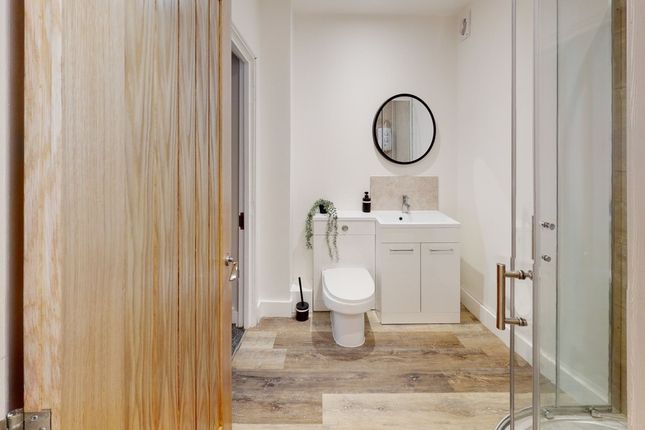 A Modern And Clean Bathroom Featuring Stylish Fixt...
