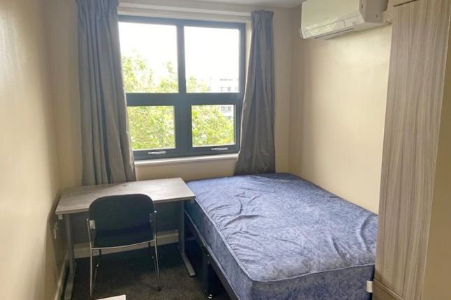 A Cozy Double Bedroom Featuring A Comfortable Bed ...
