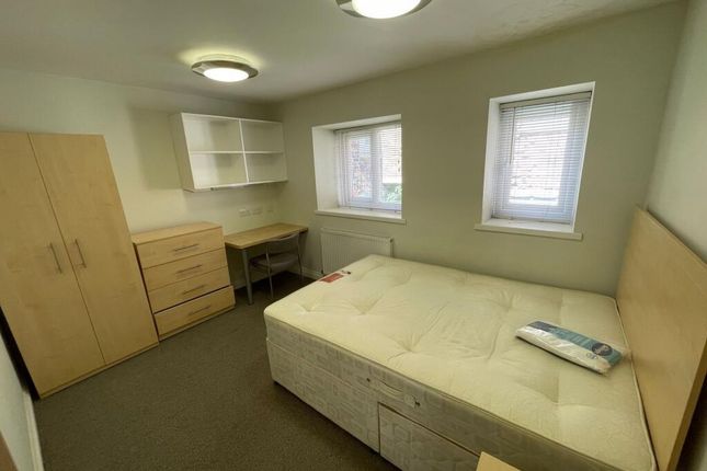 A Bright And Inviting Master Bedroom Featuring A d...