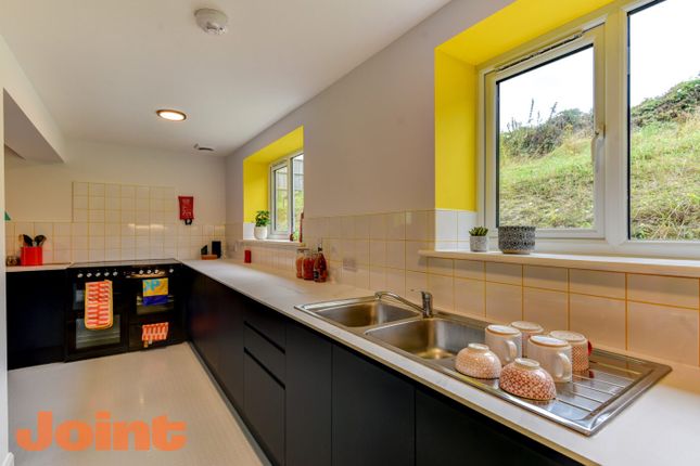 Modern Kitchen Featuring A Sleek Black And White d...