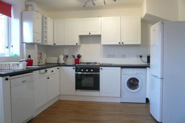 A Bright And Spacious Kitchen Featuring Modern App...