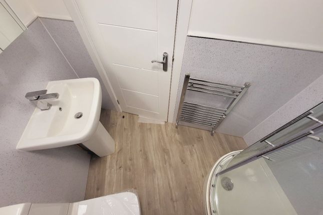 A Modern Bathroom Featuring A Sleek Shower And Con...