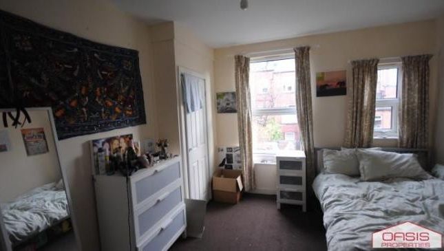 Bright And Inviting Living Room Featuring Ample Na...