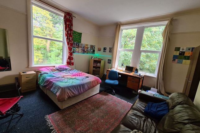 Bright And Spacious Bedroom Featuring Two Large Wi...