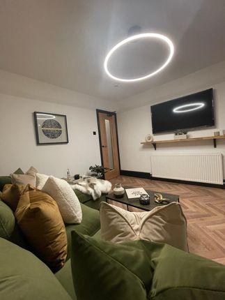 A Stylish, Contemporary Living Room Featuring A Co...