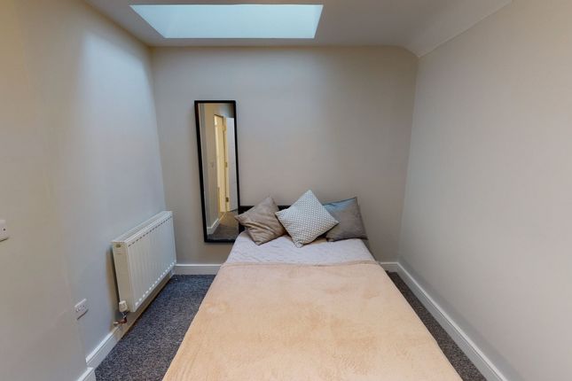 A Cozy Double Bedroom Featuring Natural Light And ...