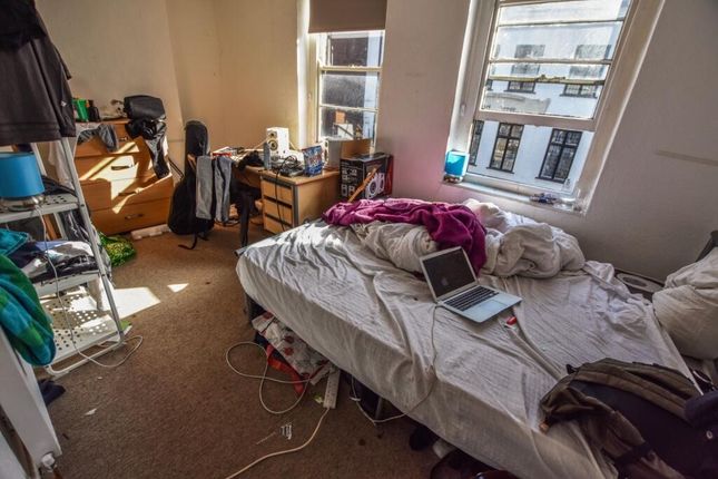 A Cozy Single Bedroom Filled With Natural Light Fr...