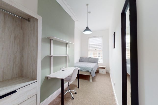 A Bright And Inviting Double Bedroom Featuring A S...