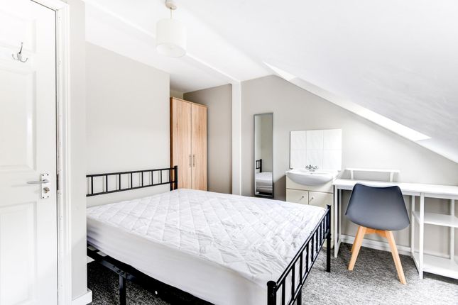 A Bright And Well-Maintained Bedroom Featuring A c...