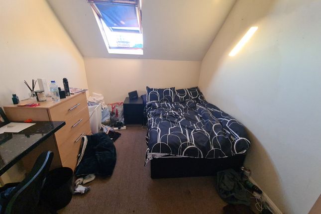 Cozy Single Bedroom Featuring A Comfortable Bed Po...