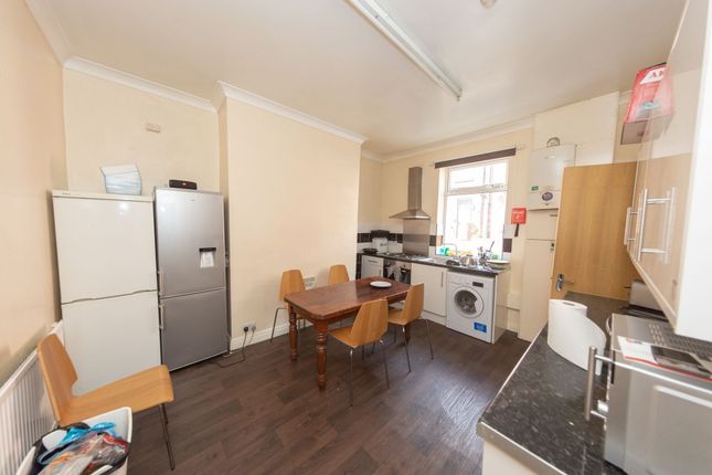 A Spacious And Functional Kitchen Featuring A Wood...