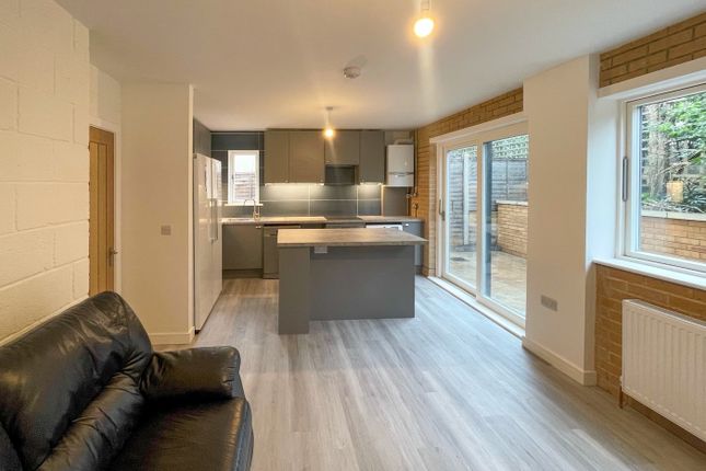 Spacious And Modern Kitchen Area Featuring Sleek c...