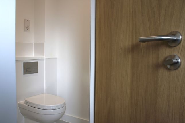 A Modern And Tidy Single Toilet With Clean Lines A...
