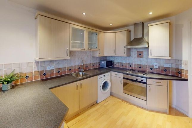 Bright And Modern Kitchen Featuring Ample Countert...