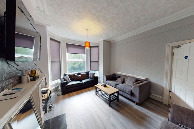 A Contemporary Living Room With A Comfortable Seat...