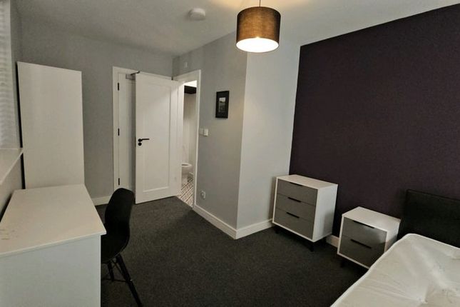 A Tidy, Well-Maintained Bedroom With Modern Furnis...