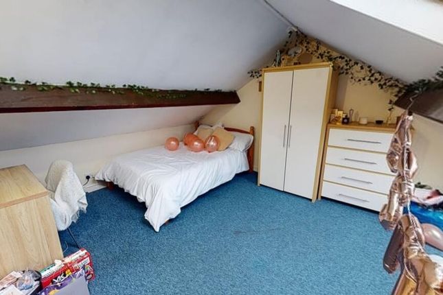 Cozy Attic Bedroom Featuring A Single Bed, Wardrob...