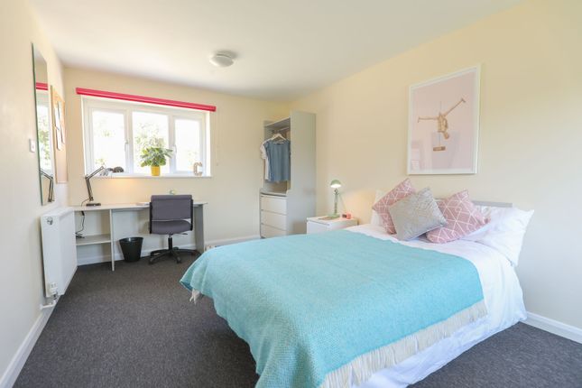 This Inviting Double Bedroom Features A Cozy Atmos...