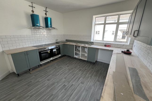 Bright And Spacious Kitchen Featuring Modern Cabin...