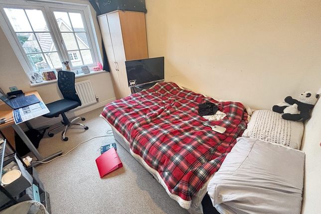 A Well-Maintained Double Bedroom Featuring A Comfo...