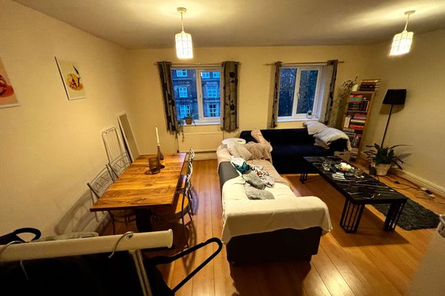 Warm, Well-Furnished Living Room With Wooden Floor...