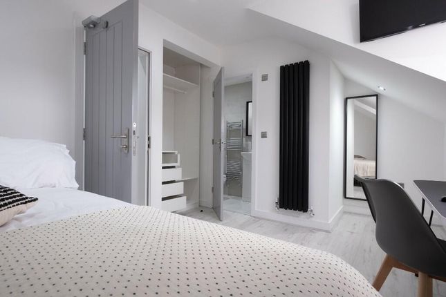 A Bright And Spacious Master Bedroom Featuring A c...