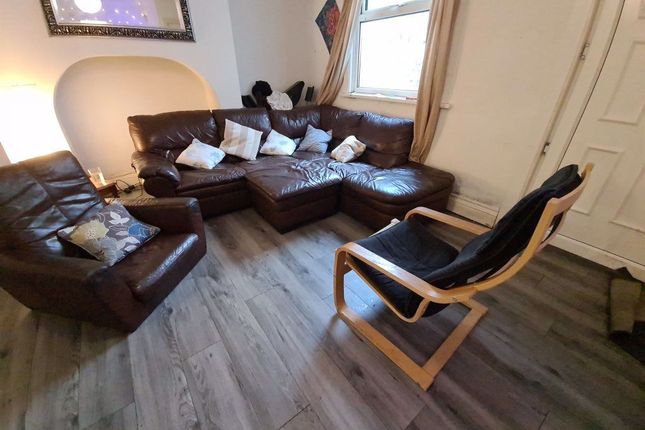 A Spacious And Inviting Living Room Featuring Comf...