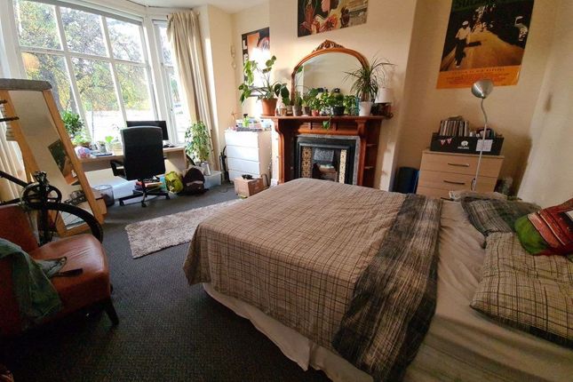 A Spacious And Well-Lit Master Bedroom Featuring A...