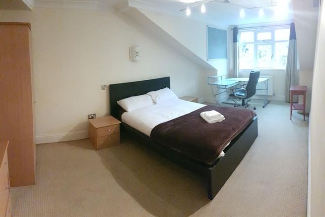 Well-Lit Double Bedroom Featuring A Comfortable Be...