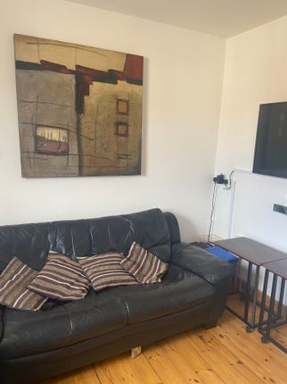 A Cozy Living Room Featuring Comfortable Seating A...