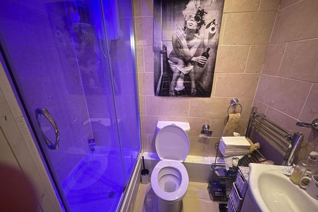 A Clean, Modern Bathroom With A Large Shower, Sink...