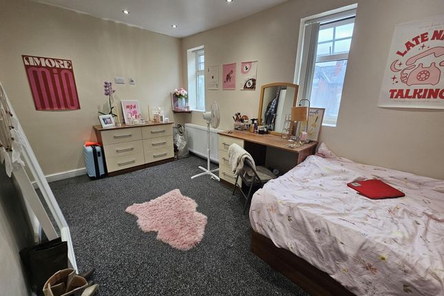 A Bright And Well-Maintained Bedroom Featuring A c...